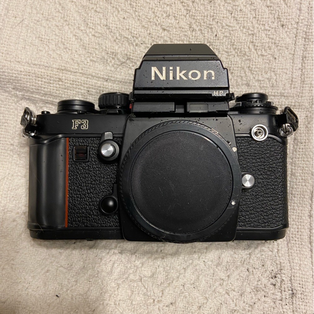 (2) Nikon F3 with Macro lens, light, zoom lens.